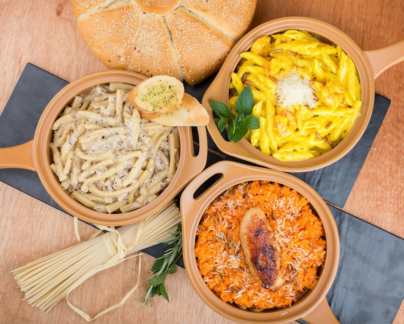 An overhead spread of several dishes to share